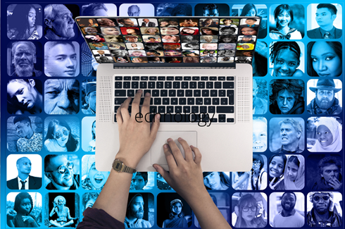 Hands typing on a laptop keyboard