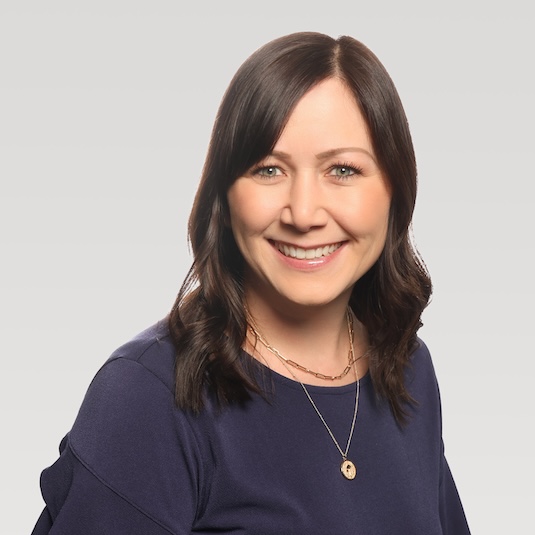 Woman in brown hair smiling